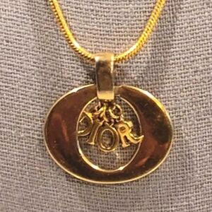 CHRISTIAN DIOR 18K GOLD PLATED NECKLACE WITH LARGE OVAL PENDANT WITH DIOR CHARMS
